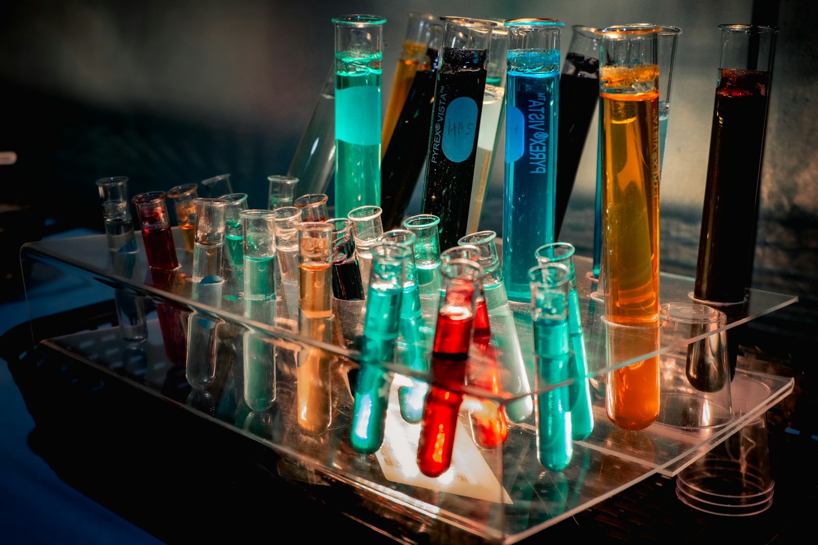 Rack of test tubes filled with different coloured liquids